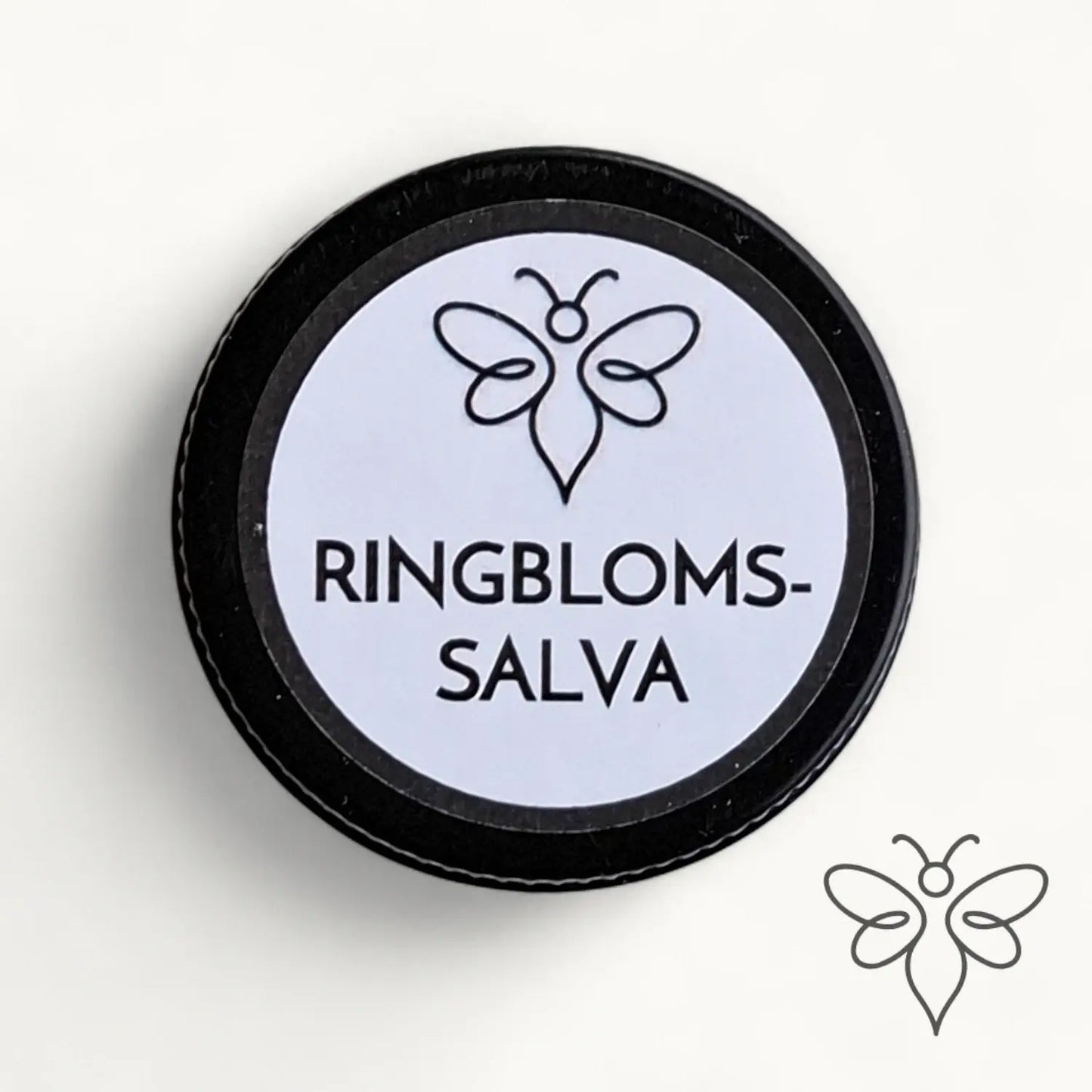 10 g burk med BivaxSalva Mini Ringblomma från EneboBee, fotograferad ovanifrån med etiketten synlig.