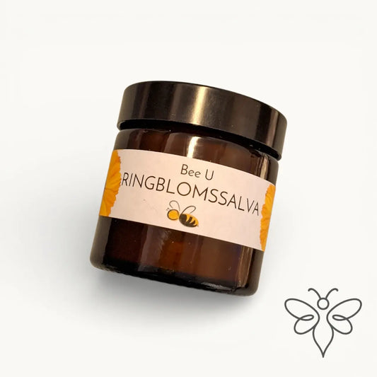 EneboBee bivaxsalva med ringblomma i en brun glasburk.